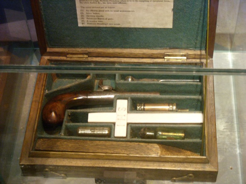 A box with stakes, hammers, and crucifix